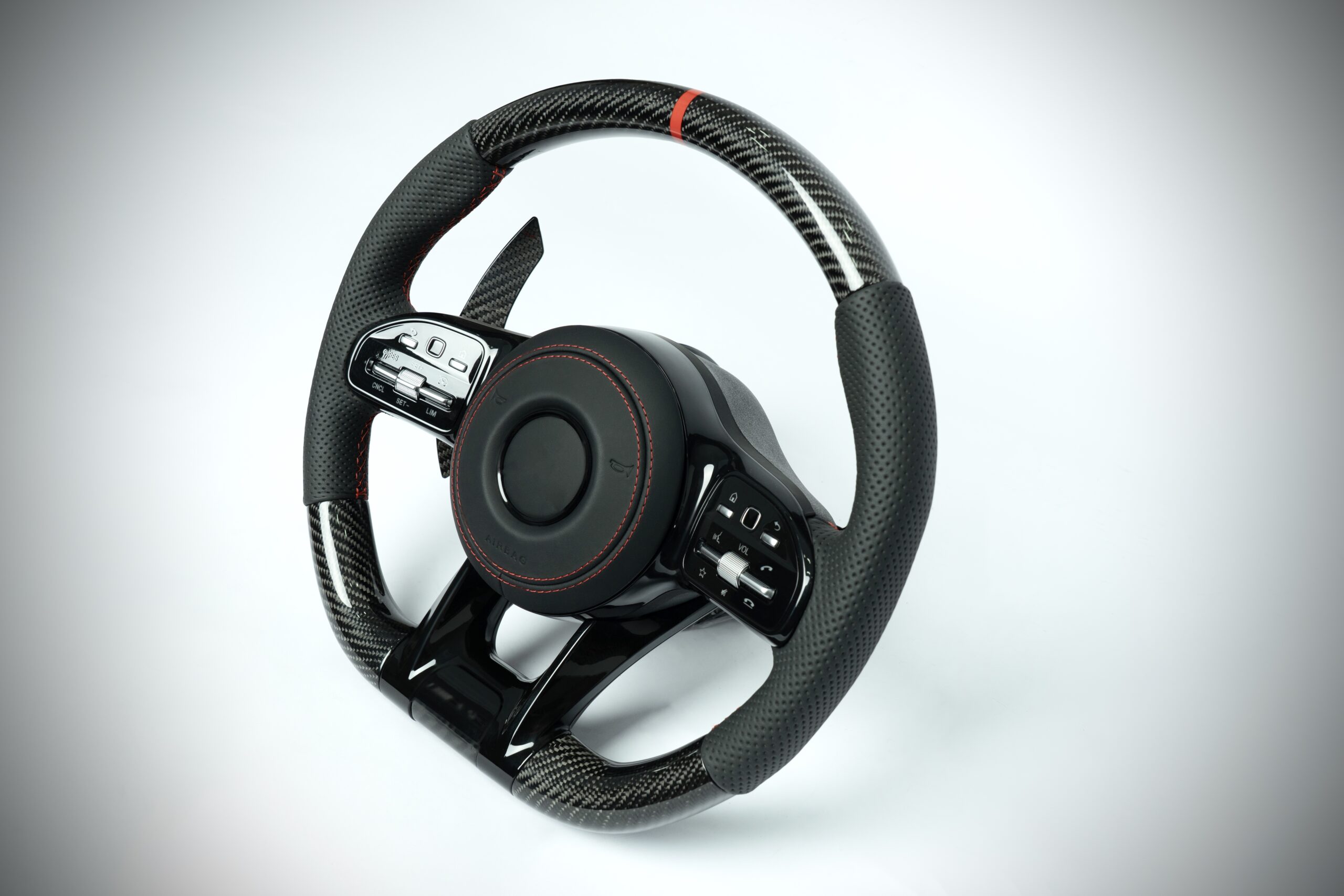 Mercedes Benz carbon fiber steering wheel with red marker and red stiching on perforated leather grip - Image 2