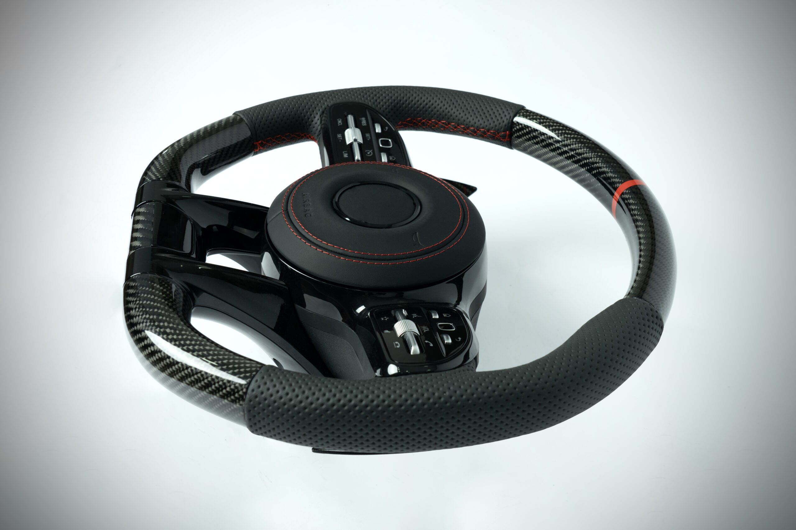 Mercedes Benz carbon fiber steering wheel with red marker and red stiching on perforated leather grip - Image 3