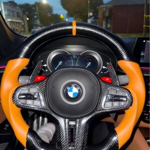 Pricing: $700.00 (item) + $80.46 (shipping) = $780.46 (total); 50% deposit ($350.00)2021 BMW 540i (G30) | Specifications: BMW G-Series M Sport steering wheel; carbon fiber at 12 and 6 o'clock positions; brown leather center stripe; full carbon fiber trim panel; extended carbon fiber paddle shifters; brown sporty genuine leather grips; brown stitching; includes ID8-style buttons; supports heating and vibration functions; M badge at the bottom.