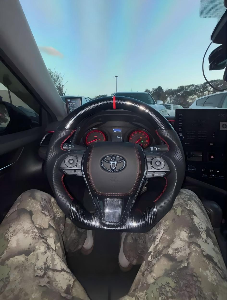2023 Toyota Camry TRD(Full Carbonfiber,Perforated Leather sport grip,Red stitching and center strip,Red stitching on airbag cover and Carbon Logo)