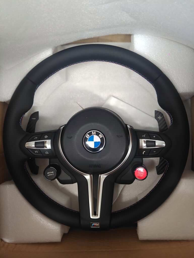 Full Leather M sport steering wheel with start/stop button,Magnetic Paddle shifters.